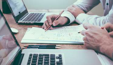 Policies and Documentation audit graphic Image of a business meeting